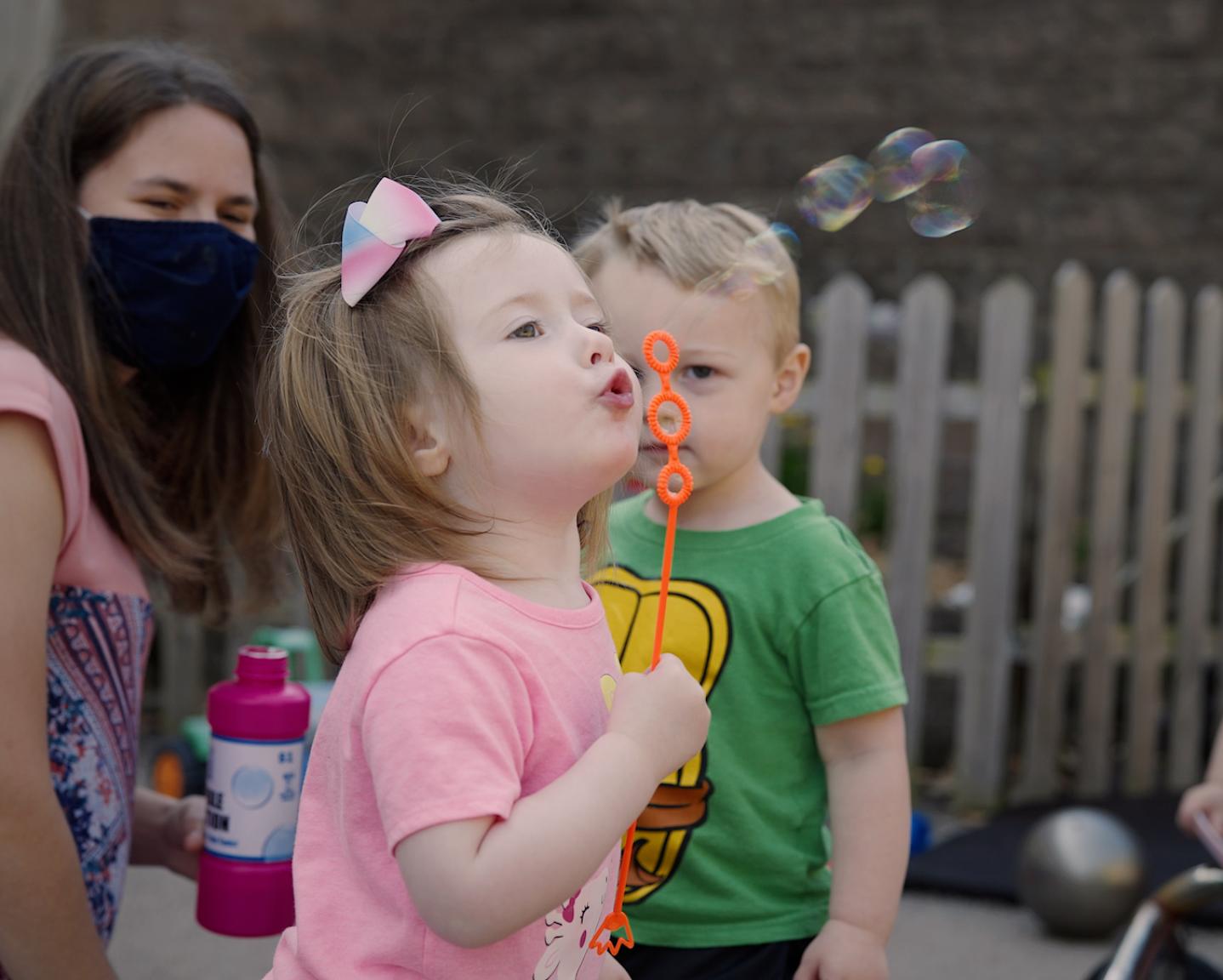 Child blowing bubbles 