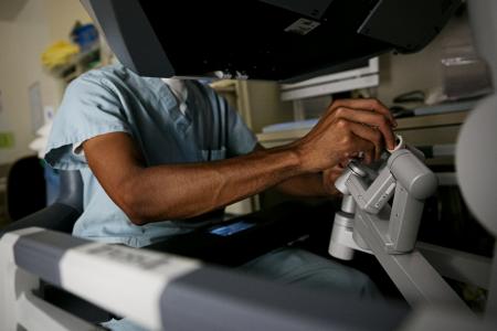 Doctor using medical equipment