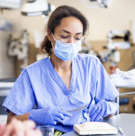 Nurse holding surgical tools