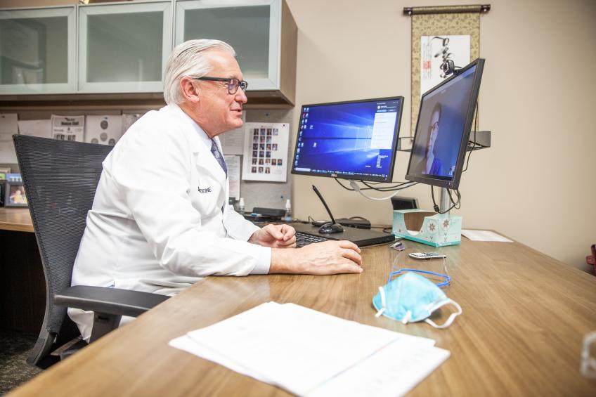 Dr. Carlson sees patient via telehealth