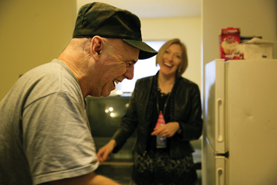 Dr. Smith and Jim Schwartz enjoy a little inside joke.